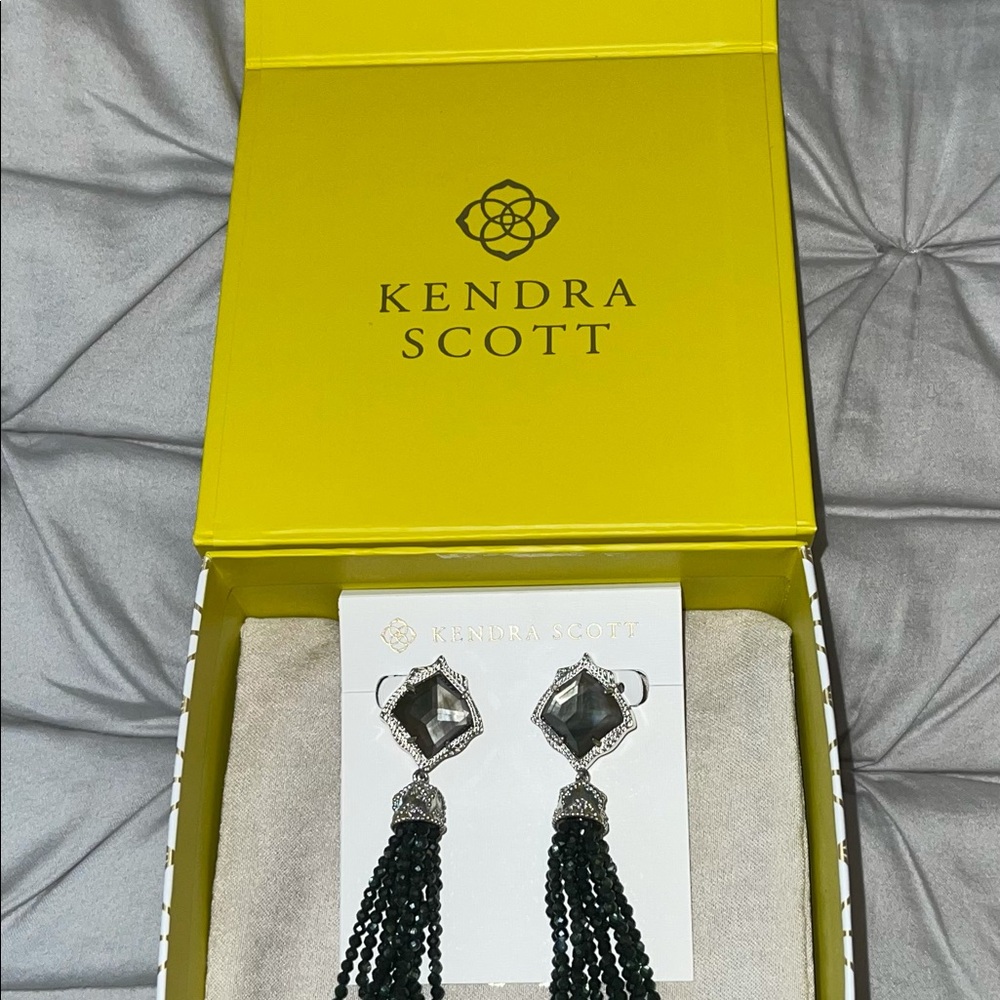 Kendra Scott black tassel earrings.